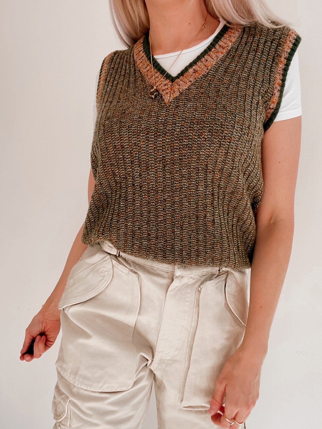 Black V-neck wool cardigan with pink/yellow pattern