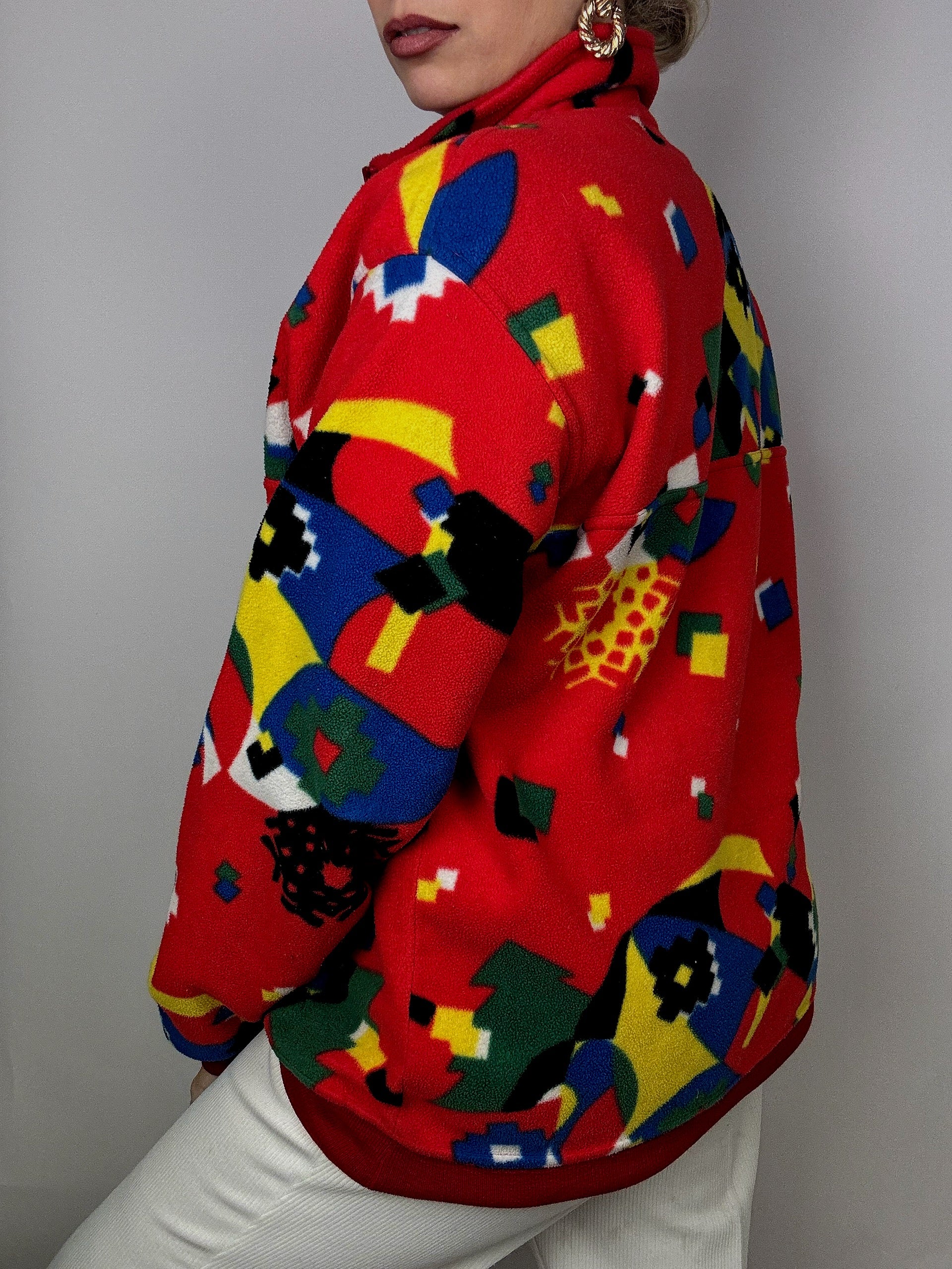 Rot/Gelb/Blau/Grün gemusterter Fleece mit Reißverschluss