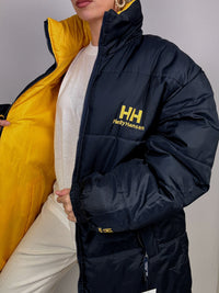 Dunkelblaue und gelbe Wende-Daunenjacke von Helly Hansen