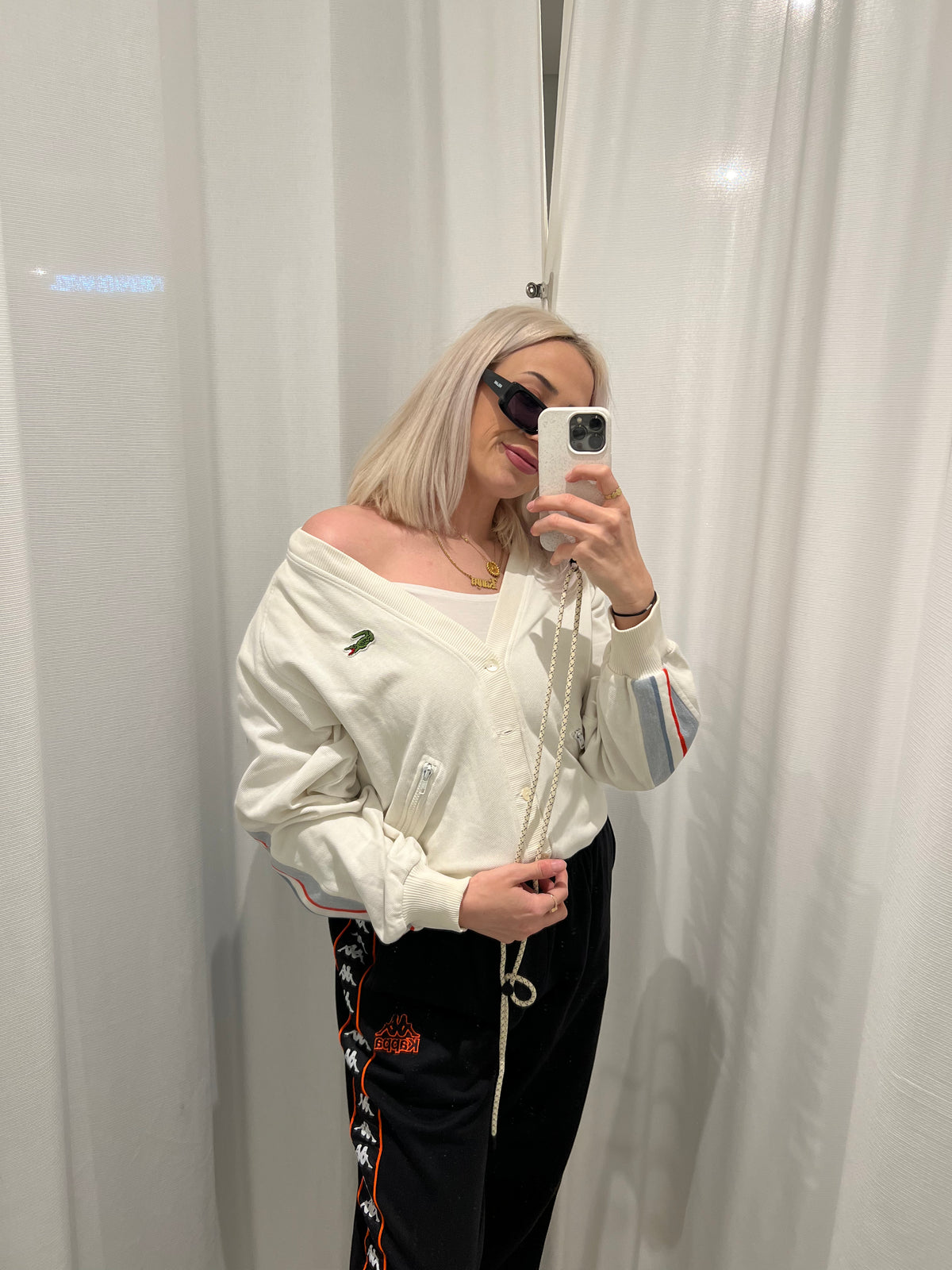 White Lacoste cardigan with stripes on the sleeves