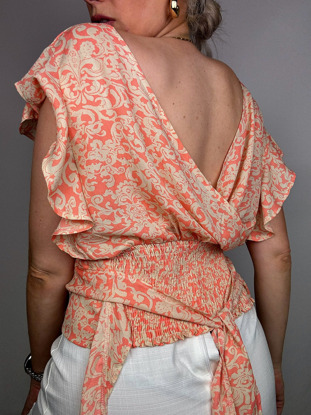 Pink blouse with beige pattern