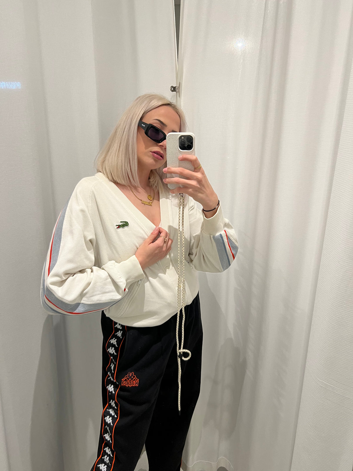 White Lacoste cardigan with stripes on the sleeves