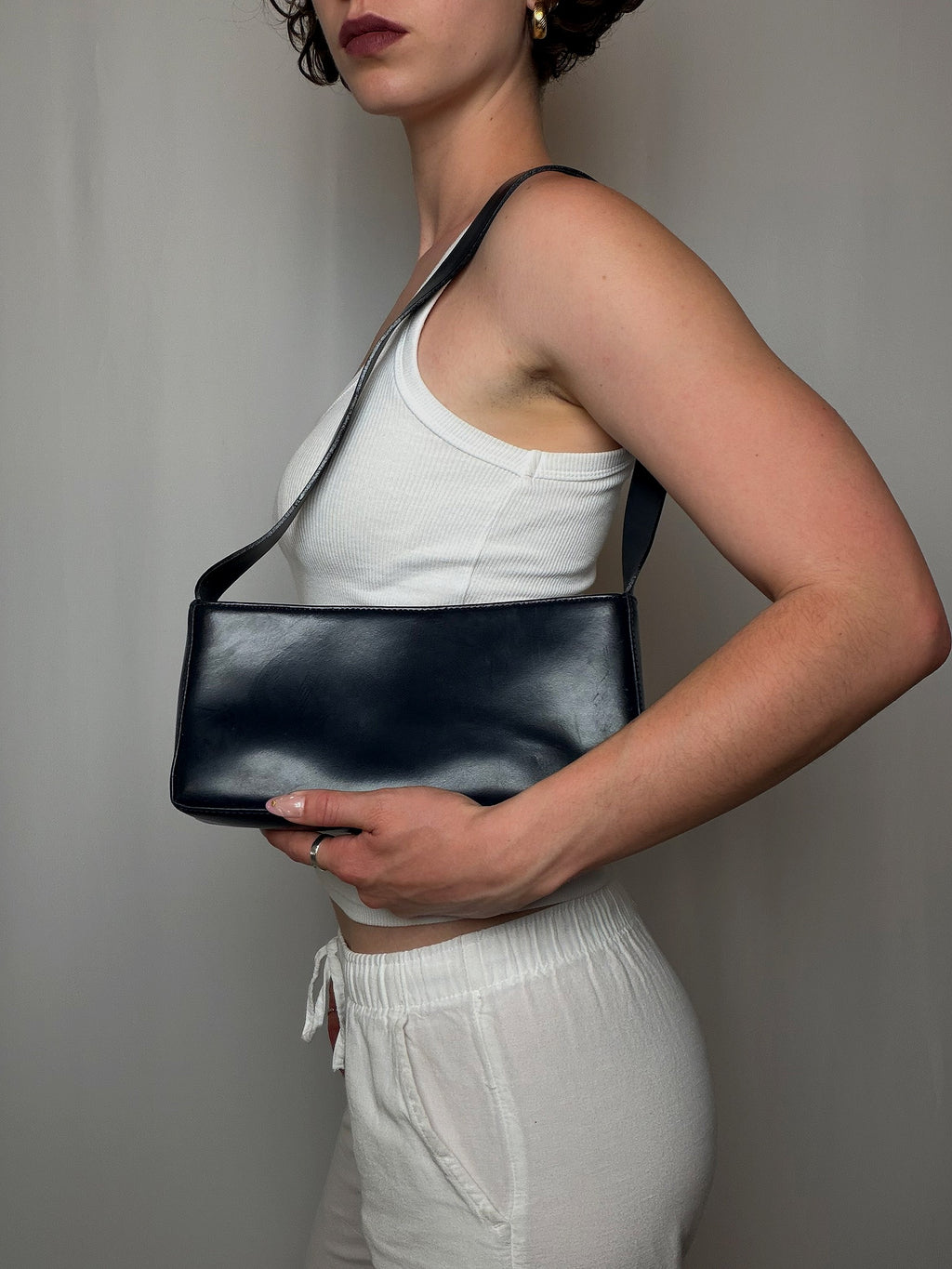 Petit sac noir baguette en cuir vintage