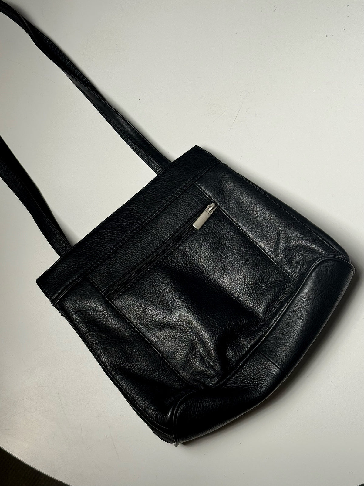 Black leather bag with zip