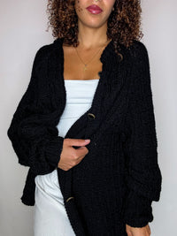 Black knit cardigan with oversized vintage jeweled buttons