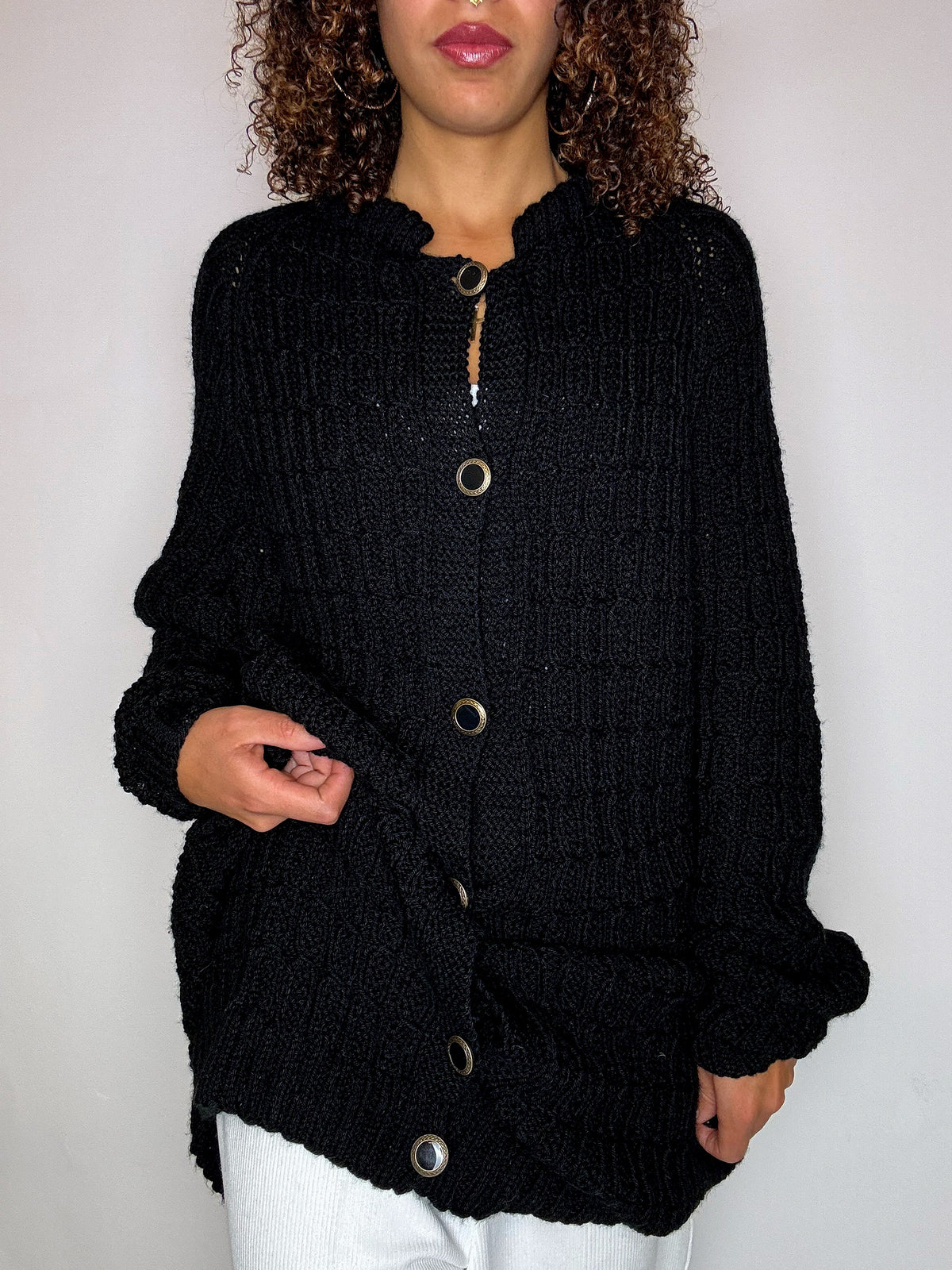 Black knit cardigan with oversized vintage jeweled buttons