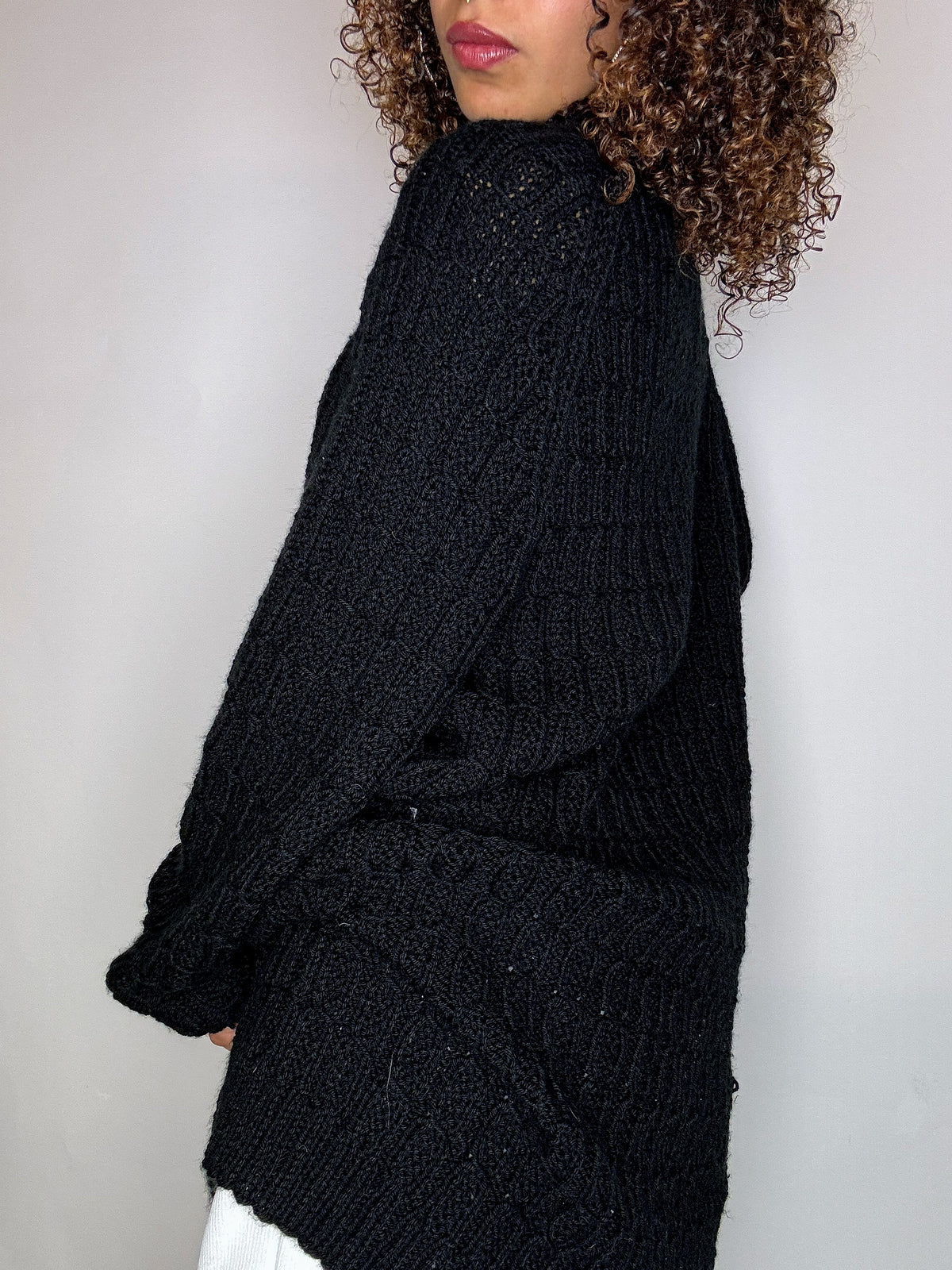 Black knit cardigan with oversized vintage jeweled buttons