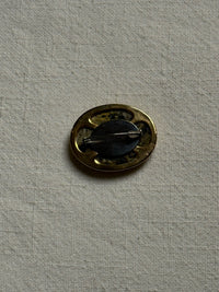 Broche ovale dorée avec pierre kaki vintage