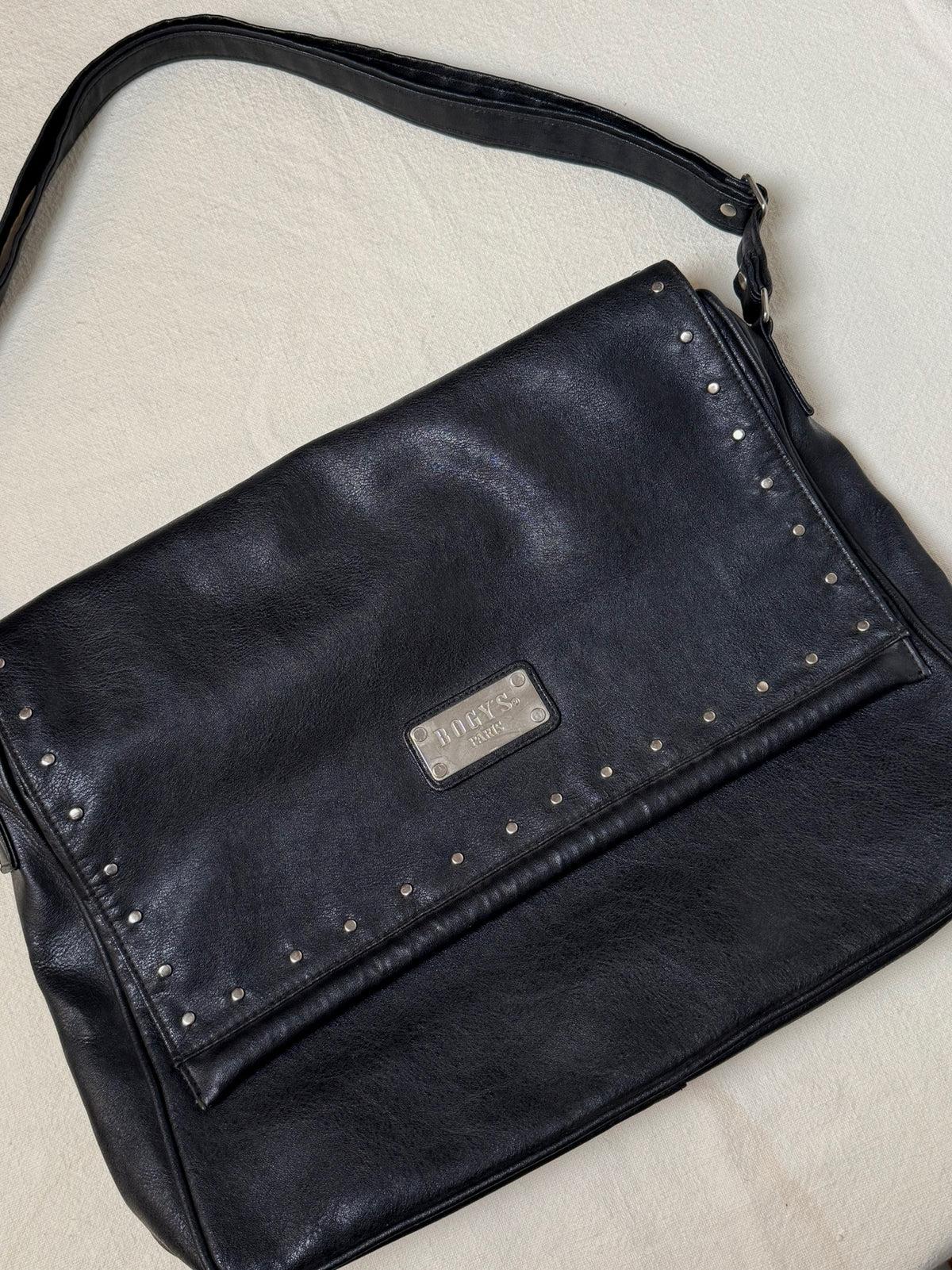 Large black leather bag with vintage studs