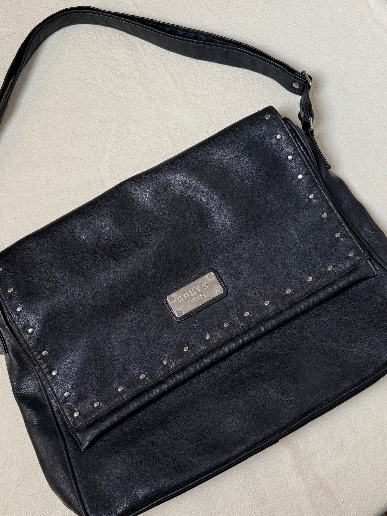 Large black leather bag with vintage studs