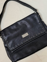 Large black leather bag with vintage studs