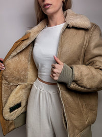 Beigefarbene Vintage-Lammfelljacke L/XL
