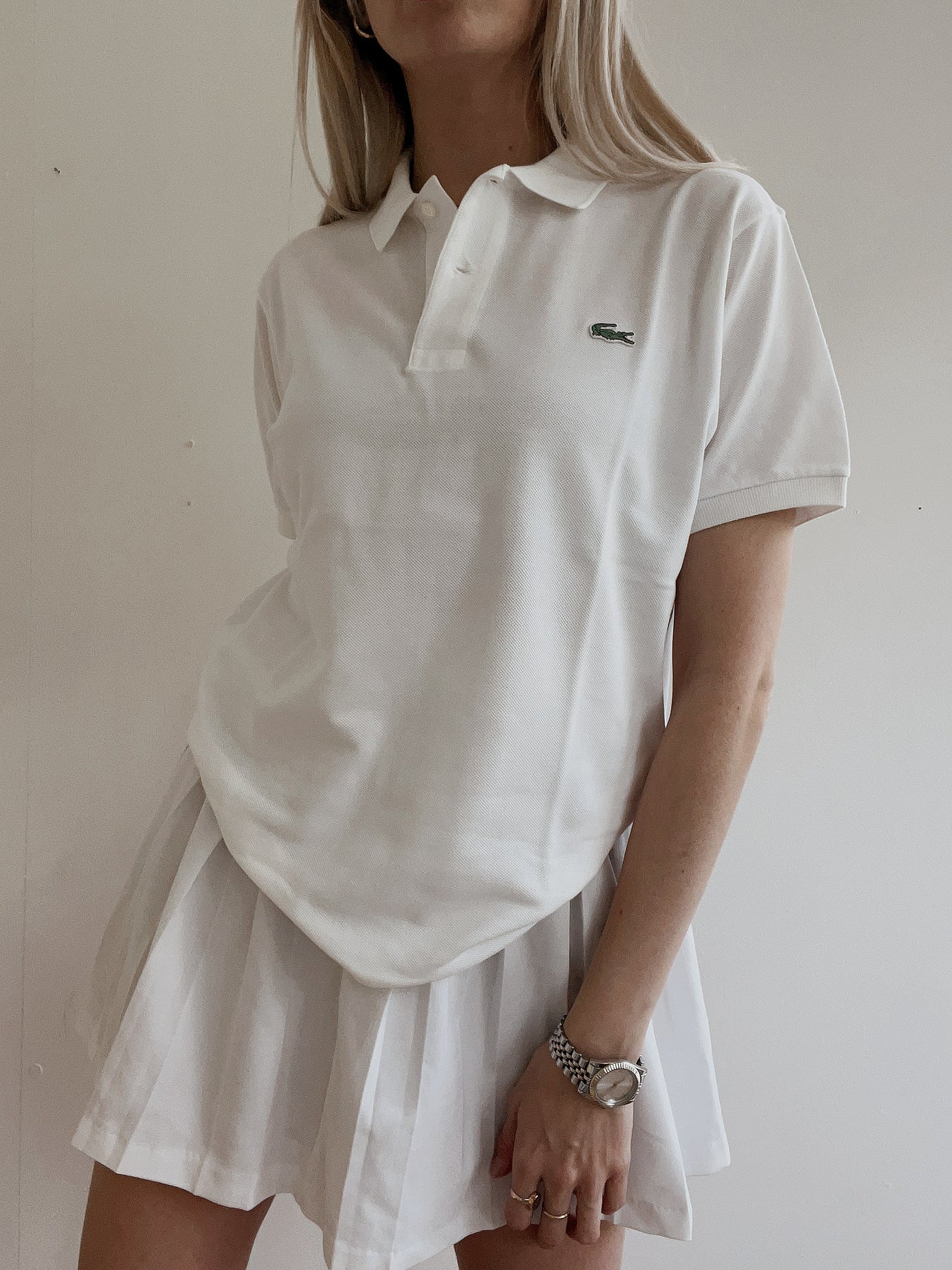 Polo Lacoste blanc XS / S