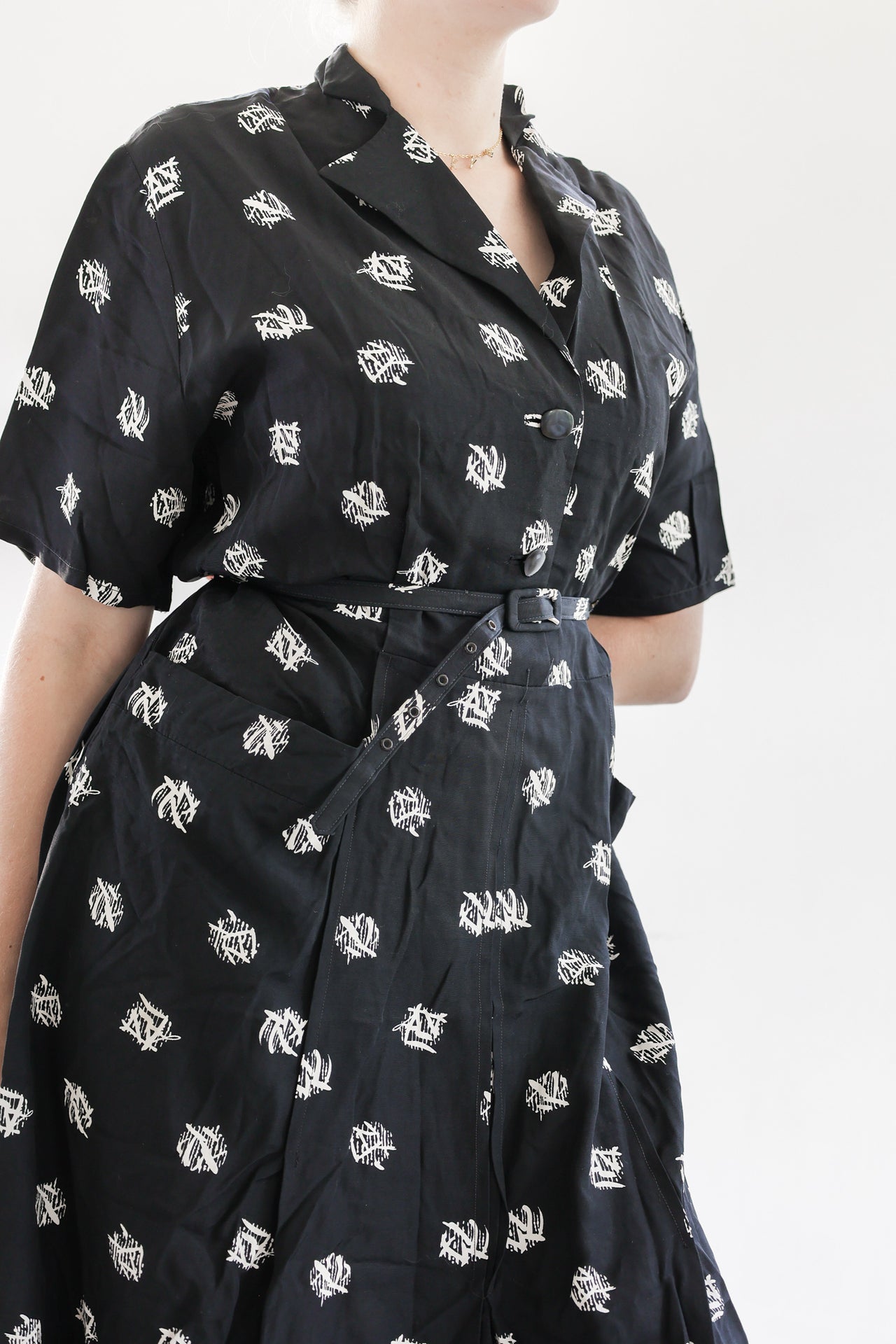 Robe noire à motifs blancs M