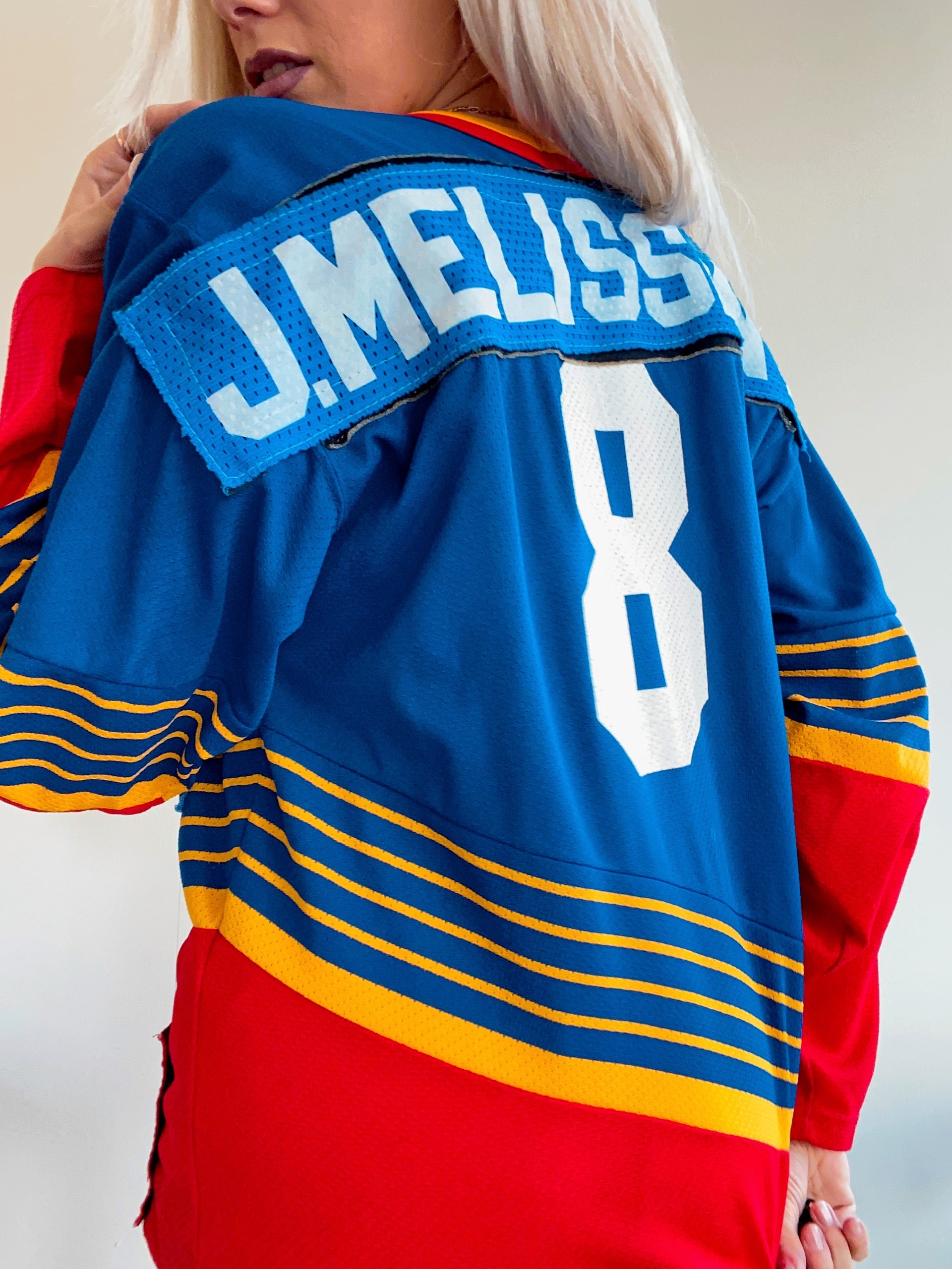 Blau-rotes Sporttrikot J.Melissant