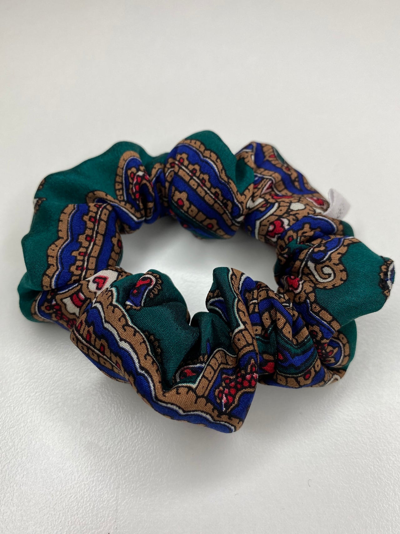 Dark green satin scrunchie with patterns by Chuperchouchou