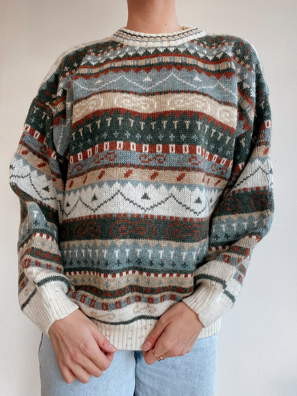 Blue knit turtleneck sweater with beige patterns M