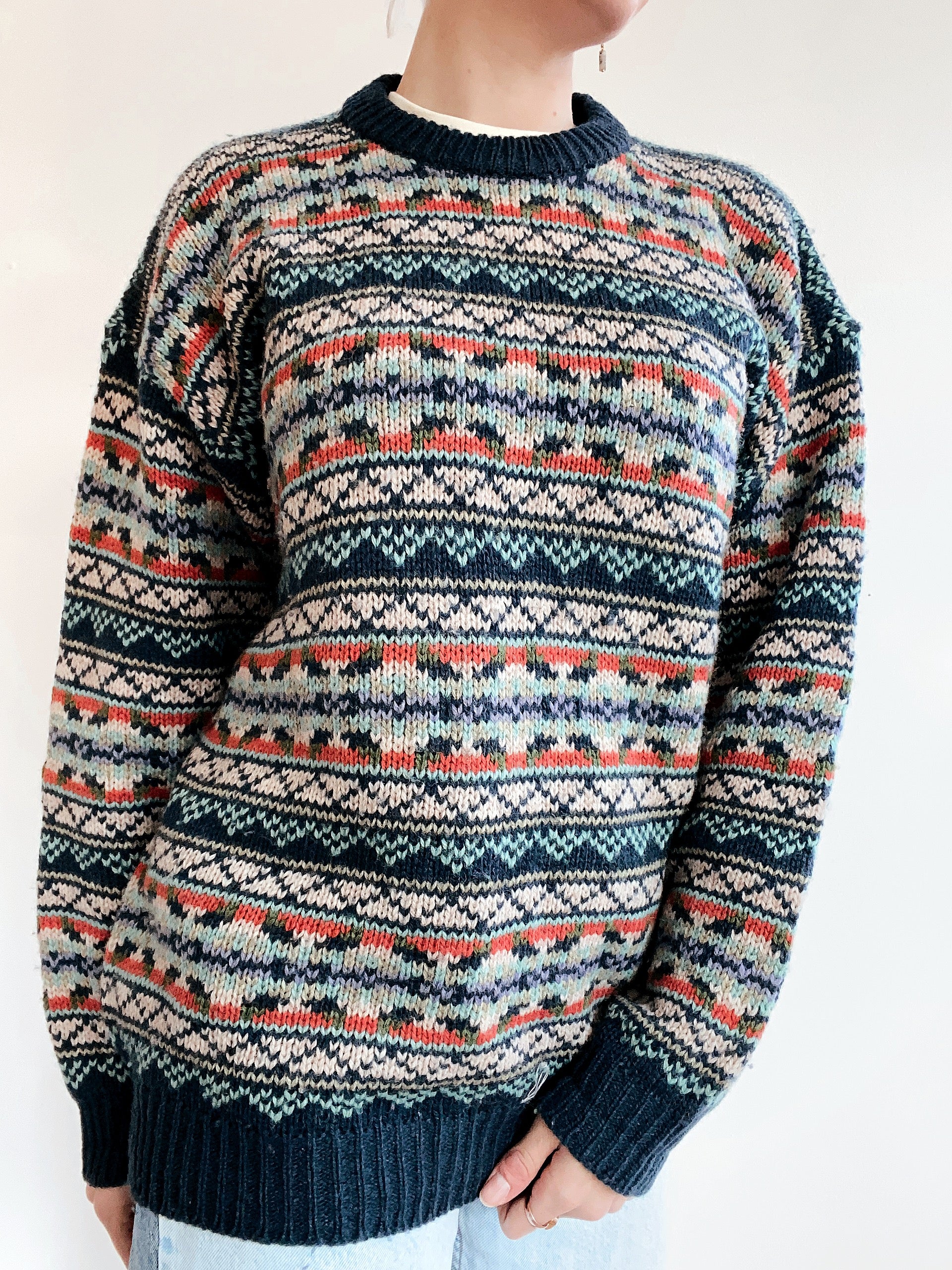 Blue knit turtleneck sweater with beige patterns M