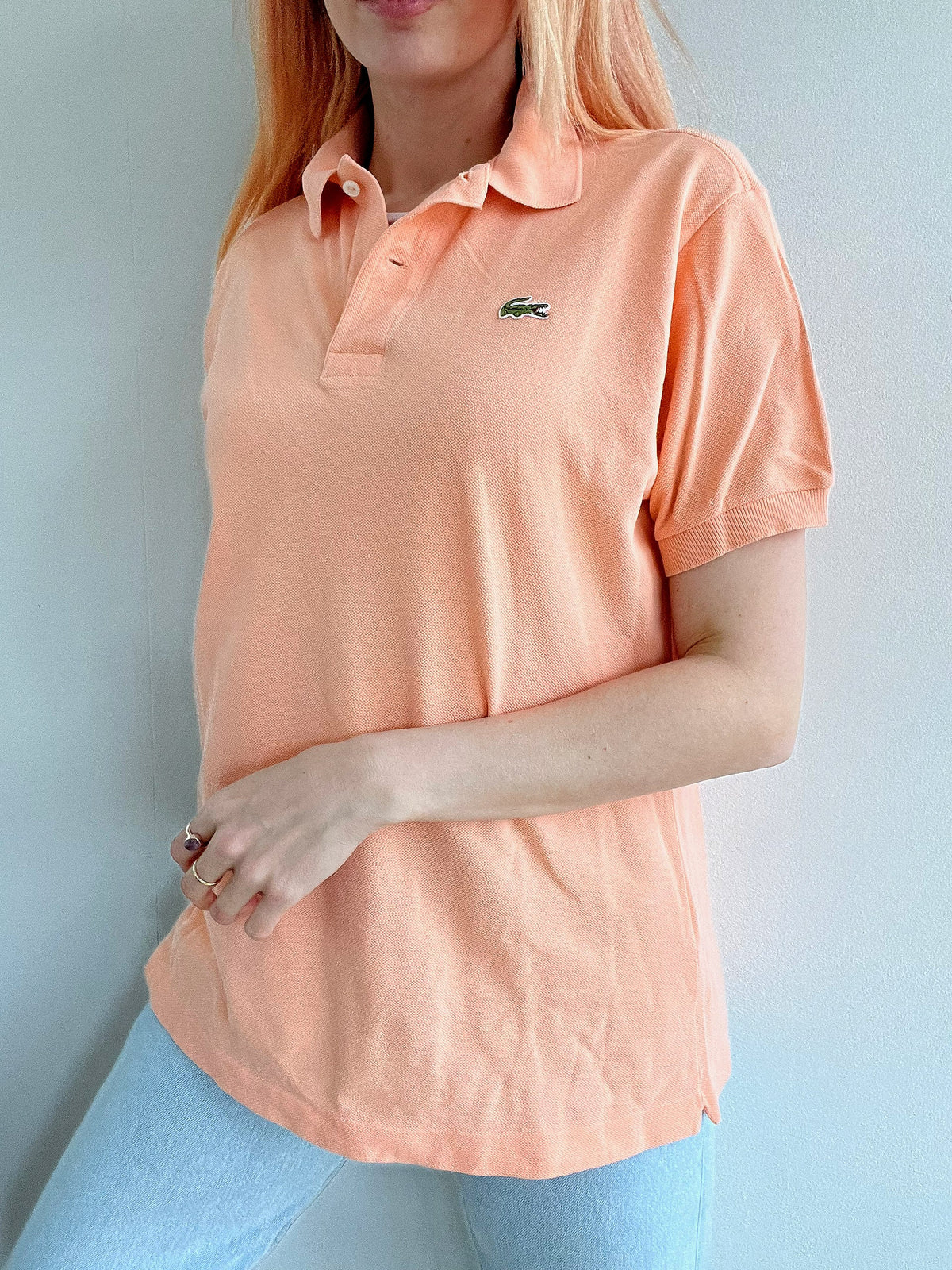 Polo Lacoste saumon clair M